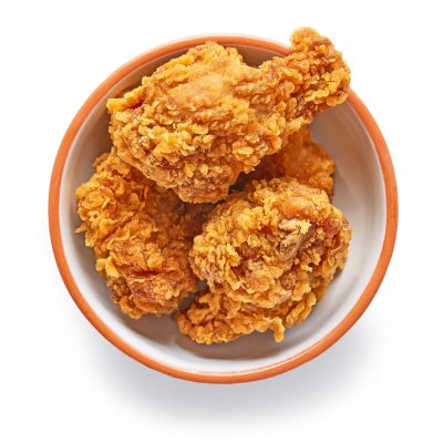 bowl of fried breaded chicken wings bowl of fried breaded chicken wings isolated on white background, top view